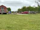 Entrance onto the campsite with the arch accommodation