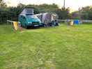 Electric grass pitch with our camper trevor