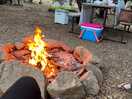 Tent in back is next campsite. site has fire ring & table. easy access. ample space. felt safe.