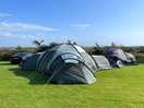 We managed to fit 2 ten man tents and a 6 man tent in our 3 pitch plot plus parking for our cars