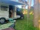 Our motorhoo.e in place on level pitch. some shade offered by trees.