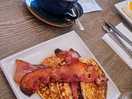 Streak bacon, maple syrup buttermilk pancakes and oat milk latte