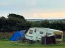 Abandoned looking caravan in the middle of the field