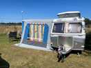 Our micro caravan and awning overlooking the fields at the back