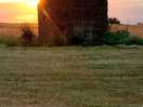Sunset behind the stone shed