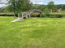 Bridge over the river to the play area