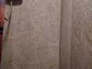 One shower stool at main door. small dirty and light on a timer that kept going off