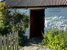 L’entrée du cottage et l’accès à la cuisine