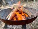The fire pit with wood etc provided.