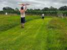 Attempting to fly a kite.