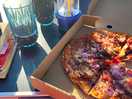 Pizza made on site and a glass of wine
