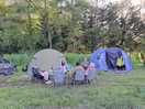 Family and friends enjoying dinner outside our tents.