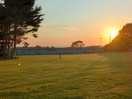 A campsite view of the sun setting