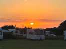 Watching the sun set over campsite