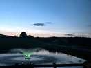 Fishing lake aerators lit up at night