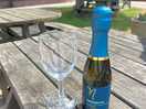 Afternoon drink outside the clubhouse while kids play in the park.