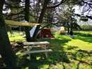 Our tent. with tarp, picknick table and fireplace for every spot.