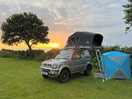 Roof tent in the sunset.