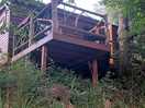 Accommodation is more like a tree house than a shepherds hut from this side. overlooking lake.
