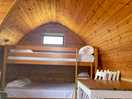 Inside camping pod with bunk beds and table & chairs. comfortable beds.