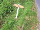 Gateway is just a regular farm field entrance, sign is an arrow shape piece of wood & fallen over