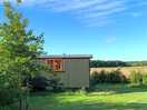 Shepherds hut overlooking county side.