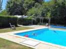 Top of our van can be seen over hedge showing how close to pool we were