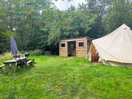 Secluded bell tent with hot tub and kitchen area