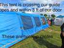 Too close , hook ups for tents on other side of field running under.