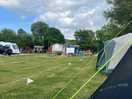 View from pitch toward showers, toilets, benches