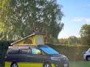 Toyota alphard camper van on a grass pitch at the green man long itchington
