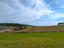 Farm and surrounding hills
