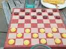 Checkers, one of the games provided
