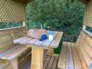 Outside seat, perfect for having supper and a bit of knitting! roof for protection from weather.