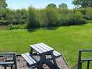 Beautiful garden and patio area overlooking the canal.