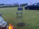 Evening campfire outside bell tent.