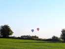 Hot air balloons on the horizon