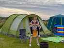 Tent pitched, owner also brings you down a fire pit to use