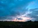 Sun setting through the clouds