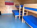 Inside a bunk comprising of 2 singles and a bunk comprising of a bottom double and single on top