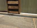 Gap under toilet and shower room doors. view from outside.