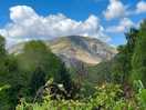 Site surrounded by mountains and hills