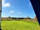 View from our tent looking out onto the football pitch, playground and shower block.