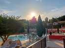 Setting sun around tge pool