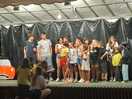 The teens singing on stage