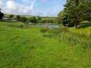 View from campervan field over the lake towards the tent field and amenities block