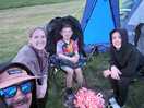 Family all around the permissable camp fire.