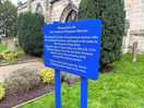 A plaque in the churchyard.