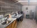 The pot washing area microwave and fridge freezer also had selection of dvds for the glamping pods