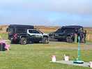 Neighboring adventure vehicles and film crew